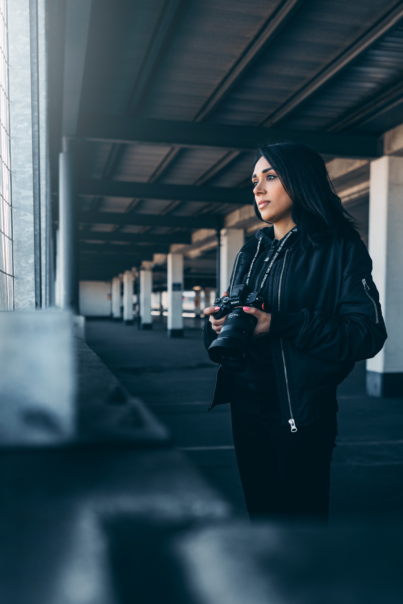 Christina of Criss Films holding her camera in a London car park