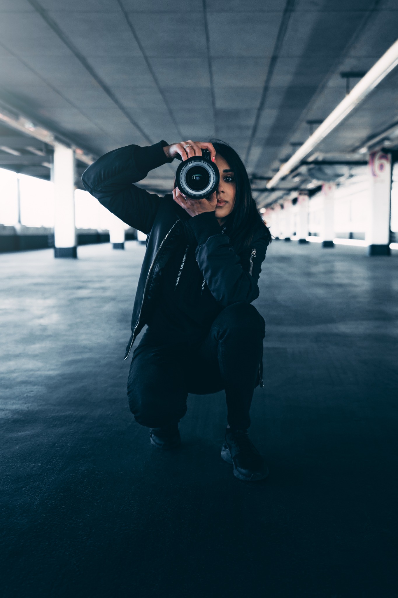 Christina photographing through her camera.
